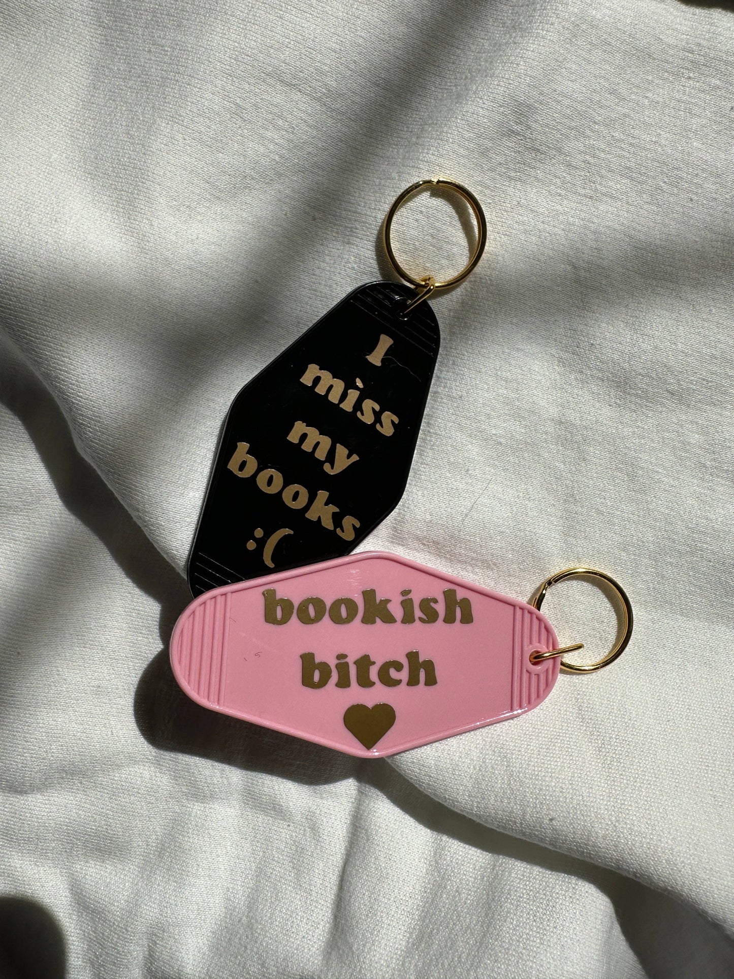 The Miss My Books Motel Keychain